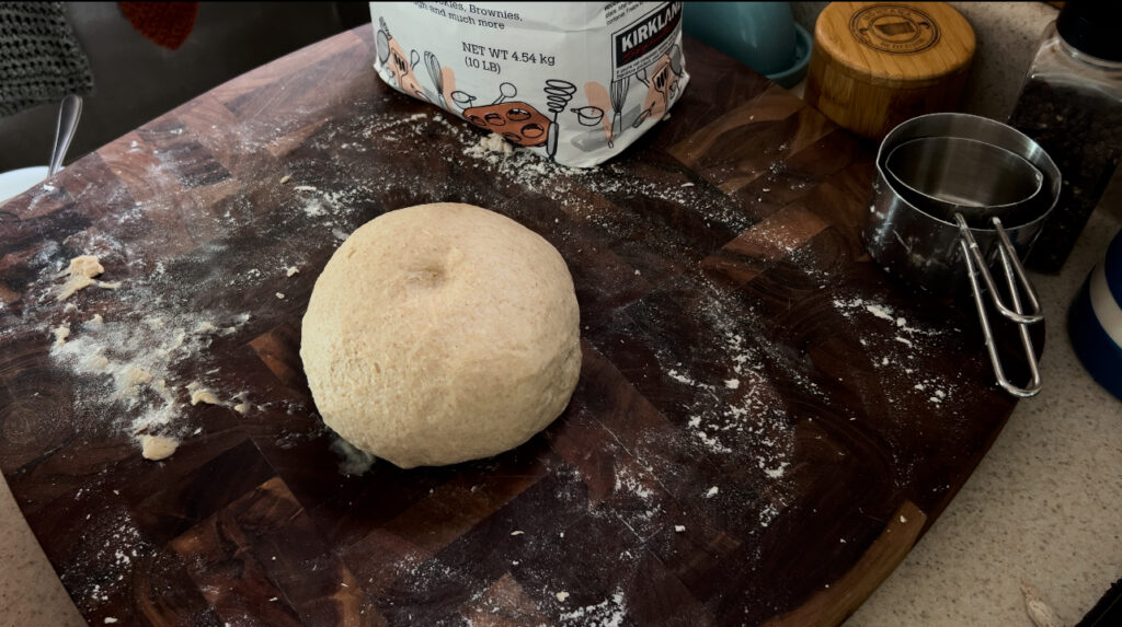 Dough for soft and fluffy honey wheat dinner rolls that is ready to be shaped into the rolls.