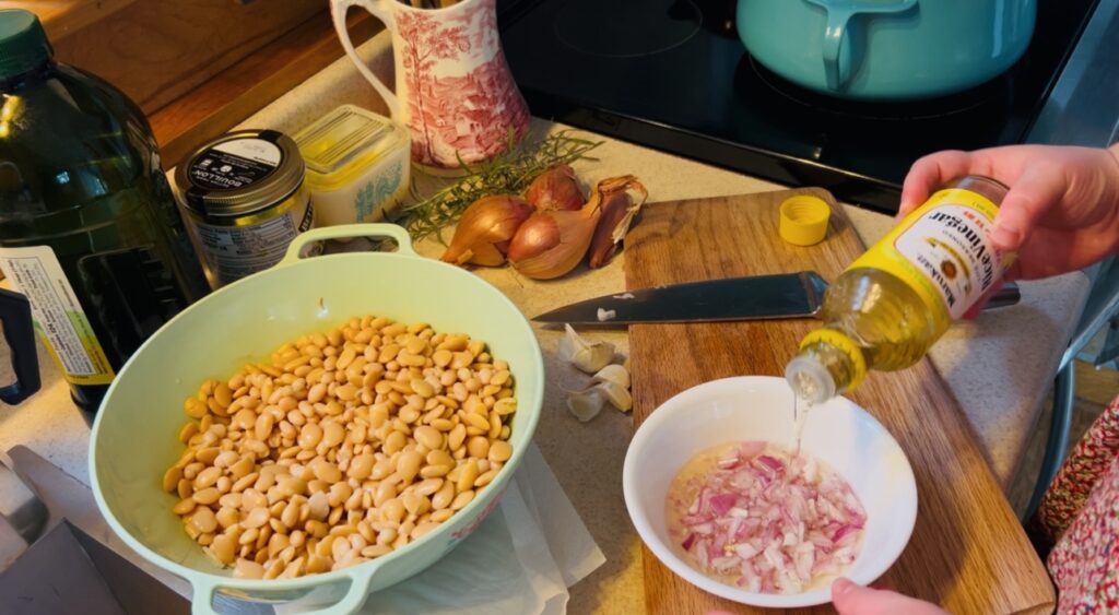 Making a quick pickled shallot for white bean and shallot soup with rosemary and garlic.