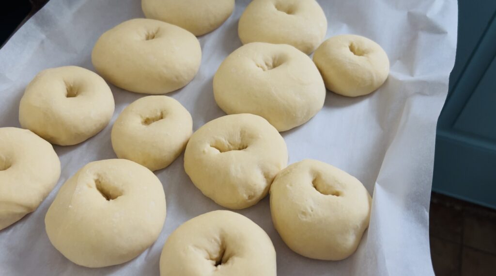 Risen bagel dough ready to be boiled and baked.