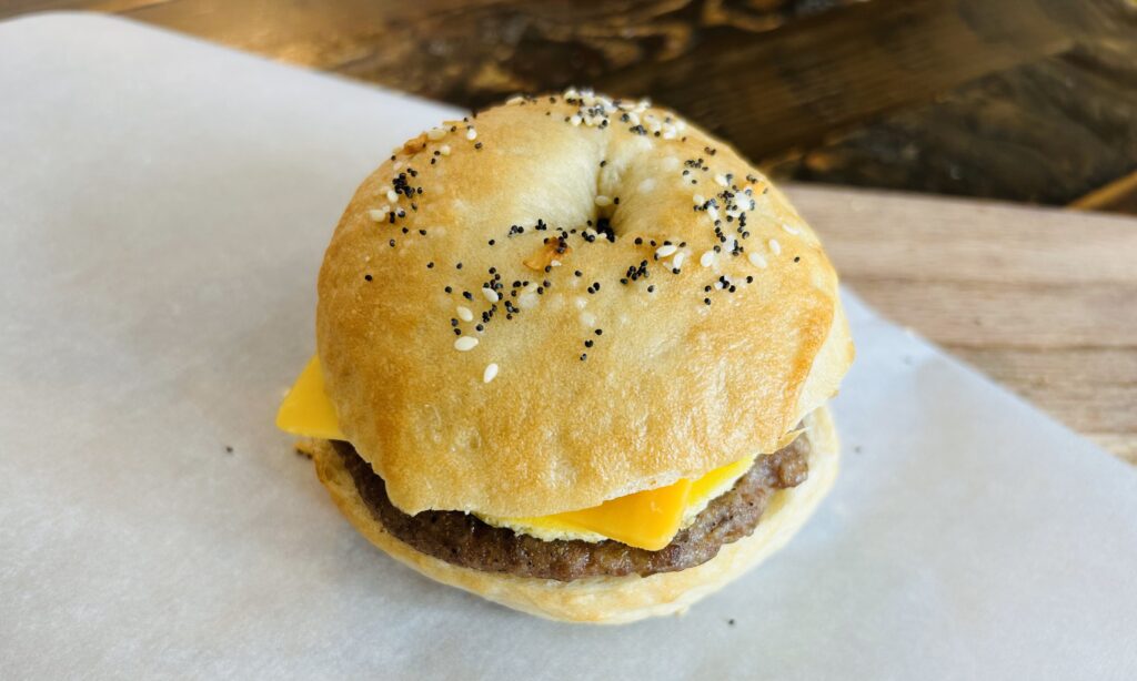 Make ahead breakfast sandwich made with a homemade sourdough bagel, sausage, egg and cheese.