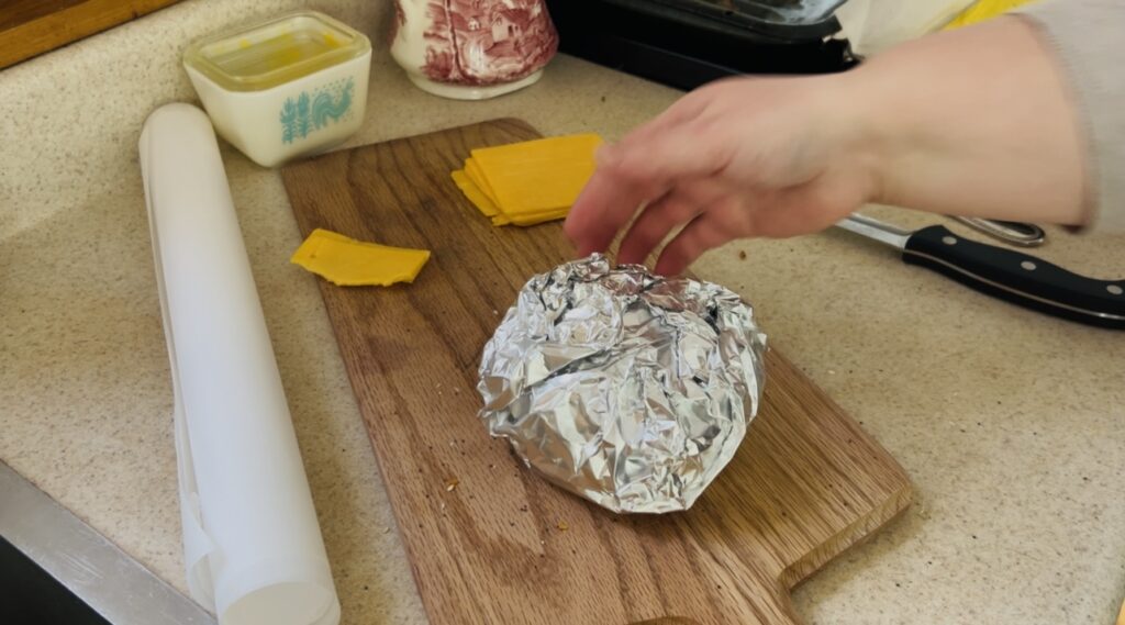 Make ahead breakfast sandwich wrapped in foil for storing in the freezer. 