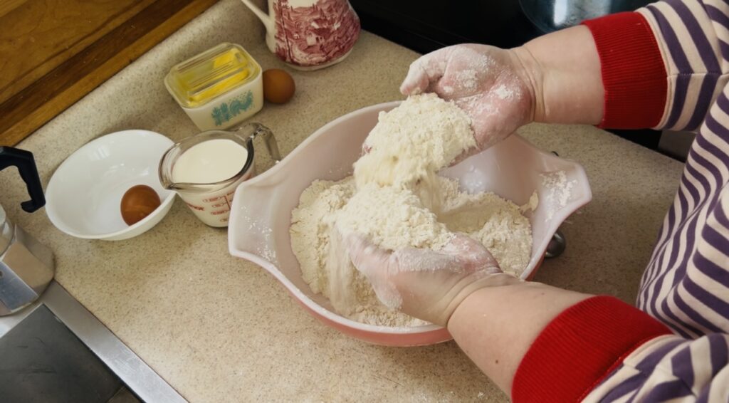 Rubbing flour and butter together for scone dough.