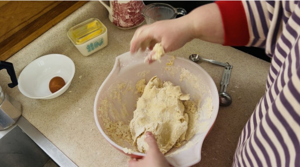 Classic scone dough coming together in a bowl.