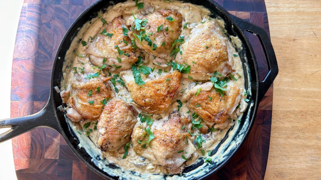 Chicken meal cooked in a cast iron skillet.