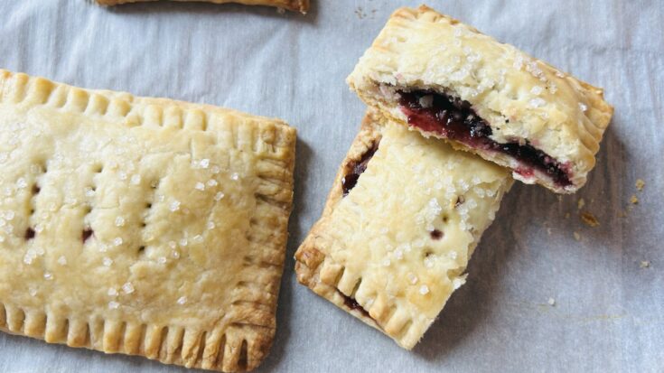 Freshly baked homemade Pop Tarts made with all butter pie crust and huckleberry jam.